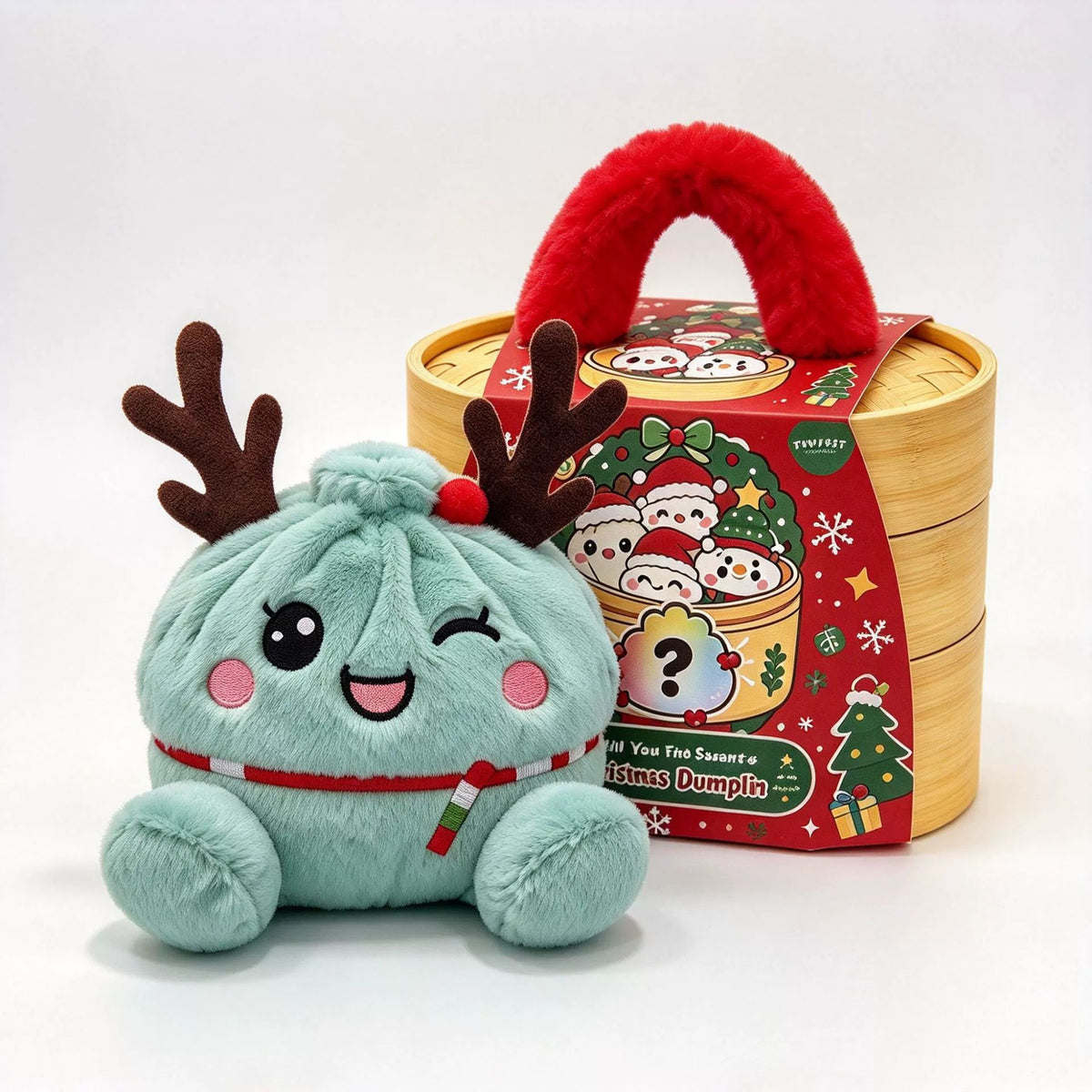 Mint green dumpling plush with reindeer antlers, red nose and striped scarf winking in front of a wooden basket
