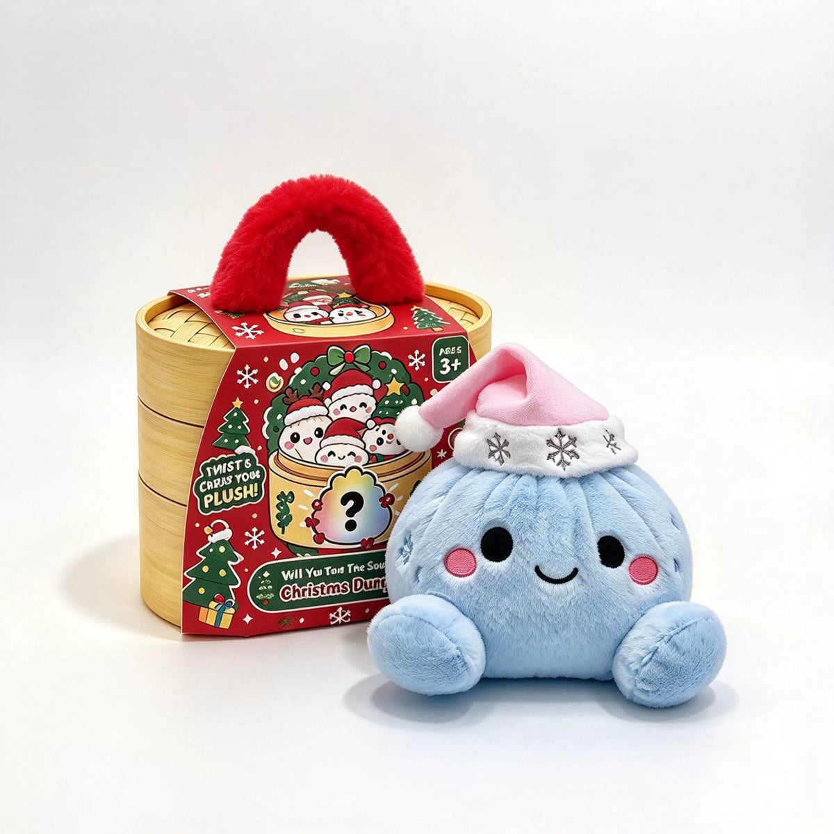 Light blue dumpling plush with a pink Santa hat trimmed in snowflake stitching, smiling beside a wooden basket